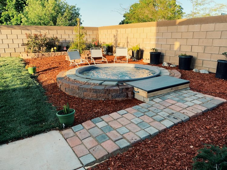 small backyard inground stock tank pool with paver patio landscaping seating area budget pool setup