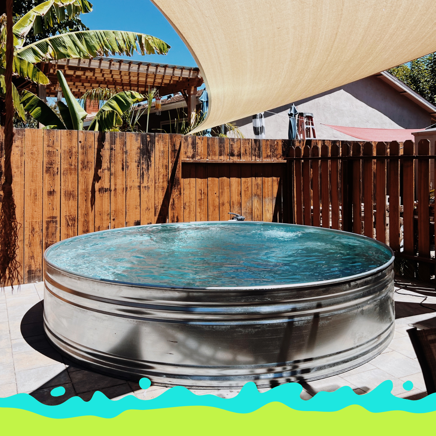 Galvanized 10foot stock tank pool with by Tipsy Tank Pools on cement and sails in a Northern California backyard.